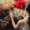 women fixing flower stand